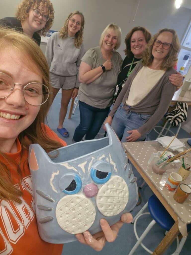 A hand building ceramics course showing a finished cat planter